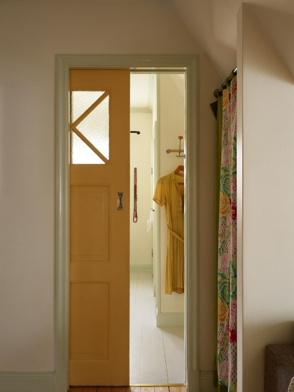 Colorful Interiors in a Wonderful Early 20th Century Swedish Villa 37 sliding yellow door