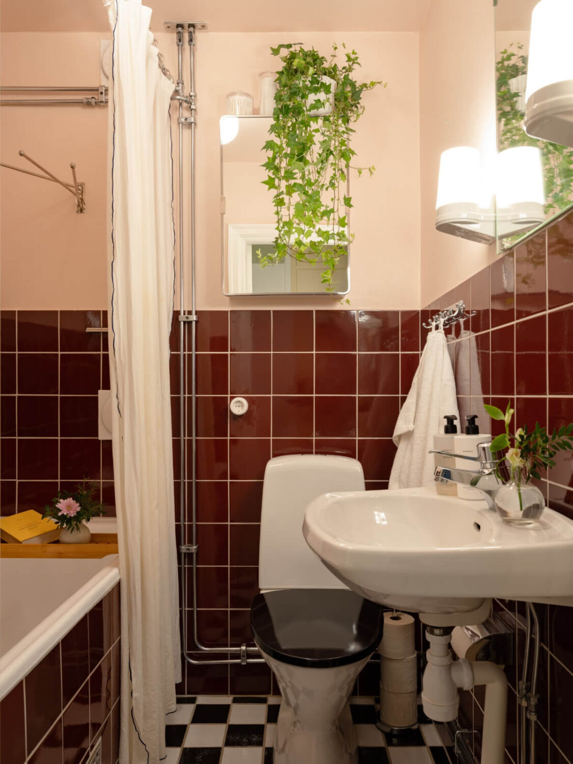 A Beautiful Well-Preserved 1930s Apartment with a Blue Kitchen 20 small-bathroom-dark-red-tiles