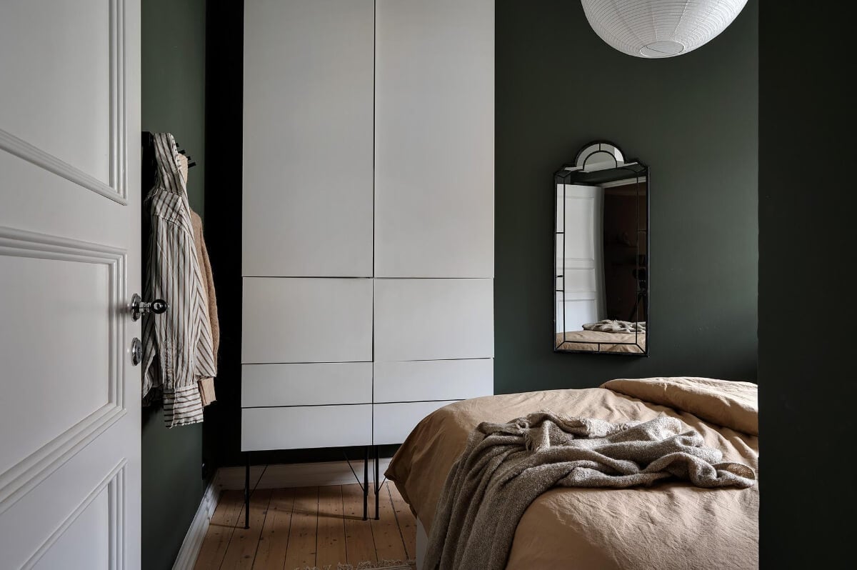A Gothenburg Apartment with a Small Dark Green Bedroom 24 small dark bedroom wooden floor