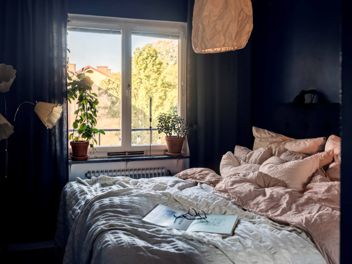 Cozy Plant-Filled Interiors in a 1940s Apartment 16 small dark blue bedroom