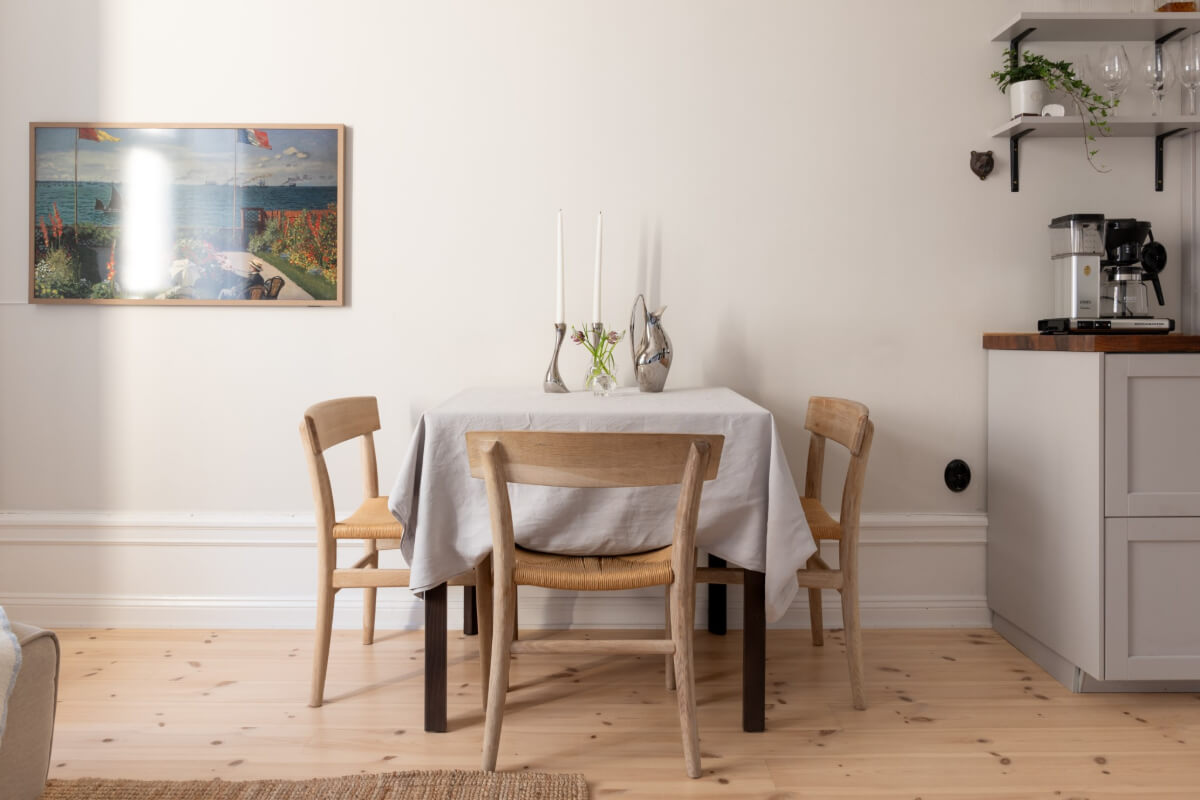 A Small Apartment Decorated in a Light Gray & White Color Palette 7 small dining table