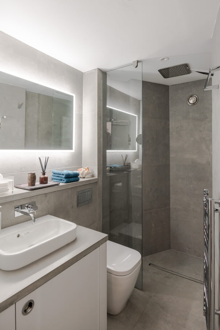 A Narrow Five-Story House with a Roof Garden in London's Clerkenwell 18 small gray and white bathroom