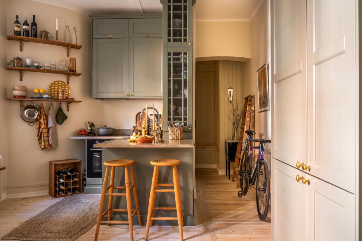 A Cozy Small Apartment with Period Features and Lots of Storage 9 small gray-blue kitchen bar seating