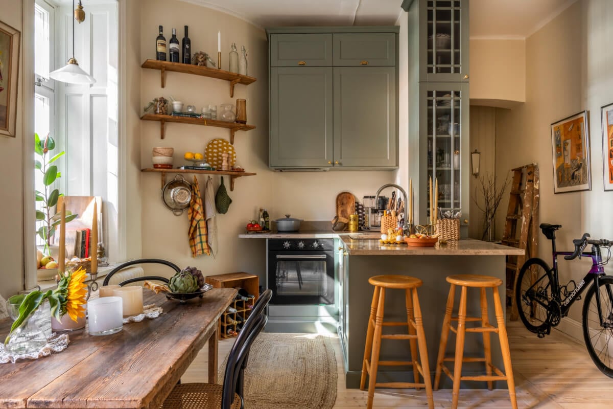 A Cozy Small Apartment with Period Features and Lots of Storage 10 small gray-blue kitchen shelves double row upper cabinets