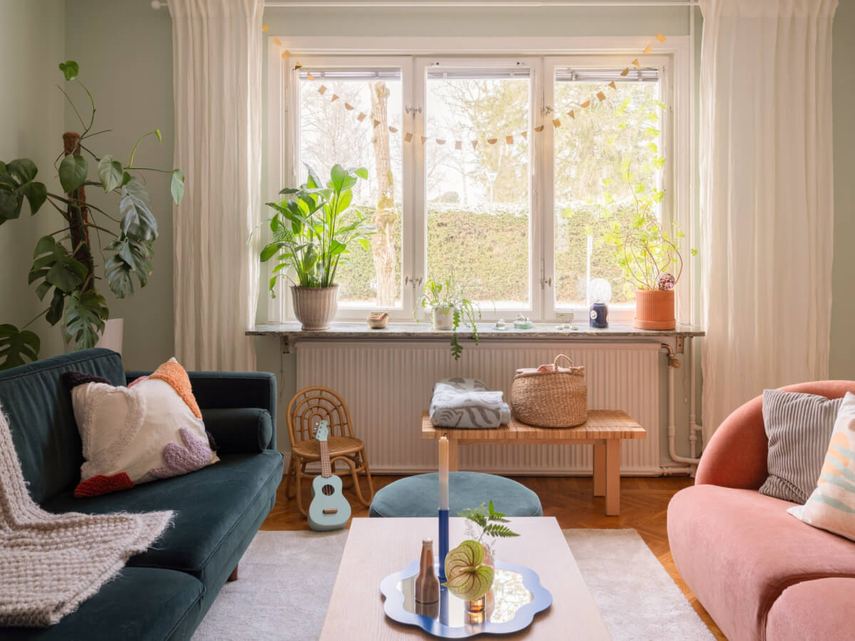 Colorful Decor in a Charming Family Duplex Apartment in Stockholm 3 small green living room