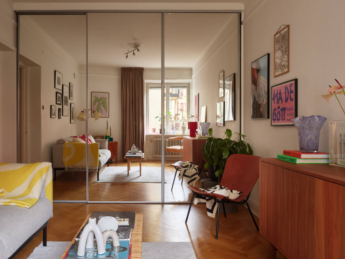 A Charming Small Apartment with a Fresh White Kitchen 7 small living room wardrobe wall mirror sliding doors