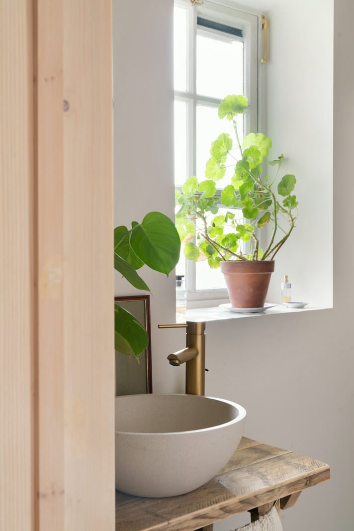 A Tiny Apartment with a Yellow Kitchen in London 14 small round bathroom sink on rustic wooden top