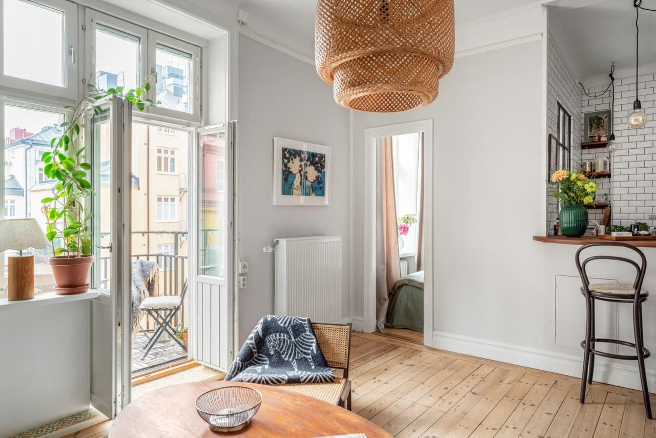 A Small Light-Filled Apartment with a Pink Bedroom 7 small scandi apartment wooden floor