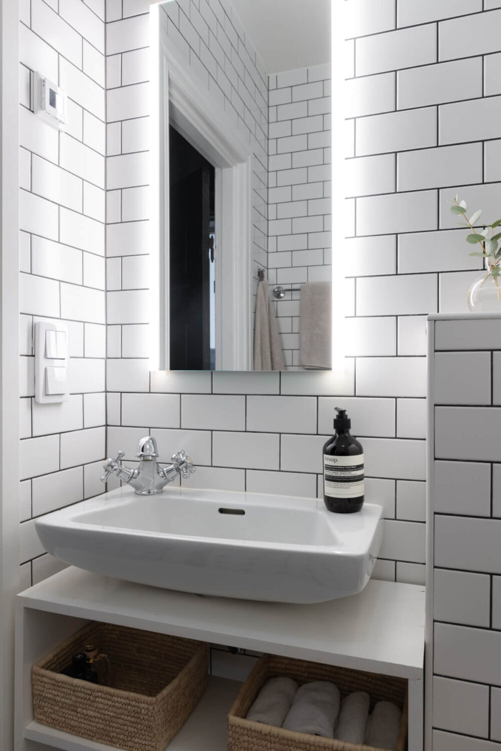 A Small Apartment Decorated in a Light Gray & White Color Palette 21 small white bathroom sink nordroom