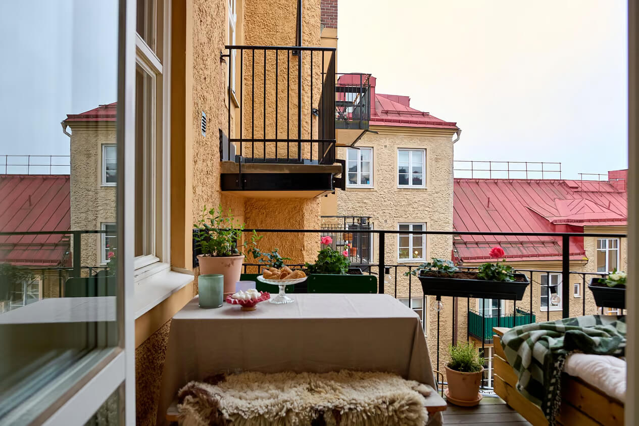 A Charming Swedish Apartment with a Spacious Balcony 6 spacious balcony with lounge area and table