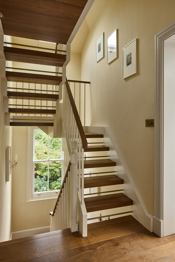 A Renovated Early Victorian Townhouse Decorated in Green Tones 20 staircase dark beige walls A Renovated Early Victorian Townhouse Decorated in Green Tones