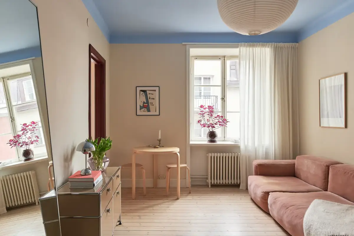 A Colorful Studio Apartment in Stockholm 1 studio apartment blue ceiling wooden floor