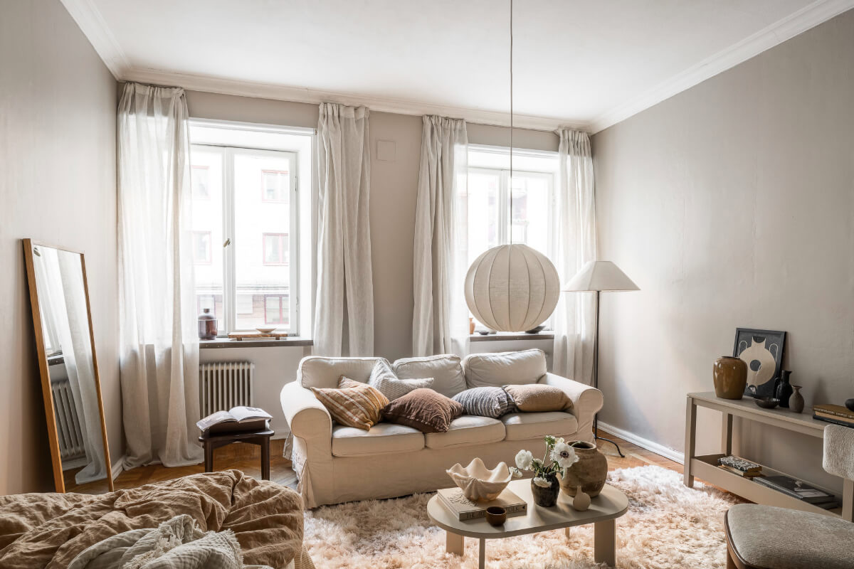 A Light Swedish Studio in an Early 20th Century Building 3 studio apartment layered textiles