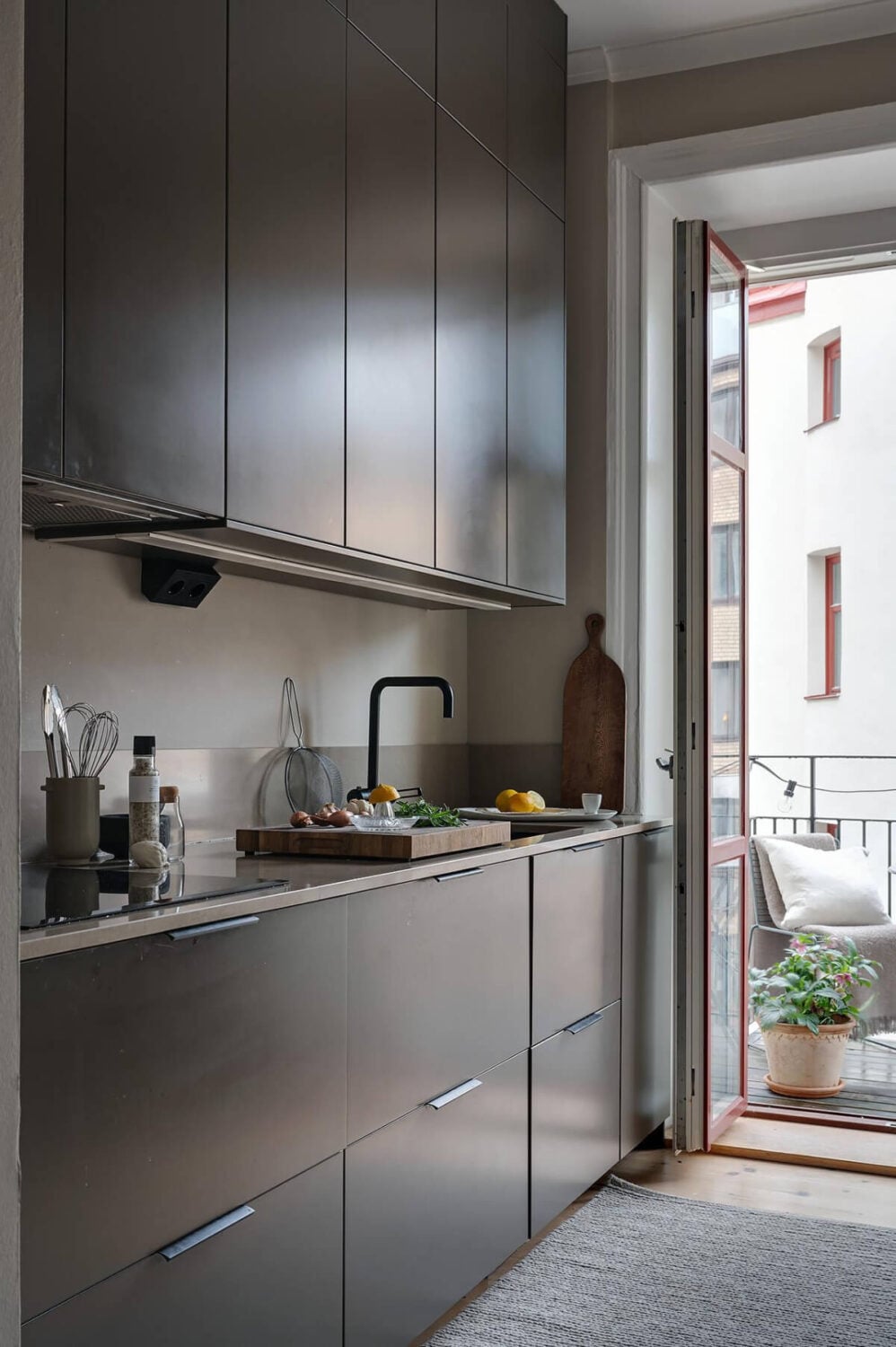 A Gothenburg Apartment with a Small Dark Green Bedroom 14 stylish black kitchen