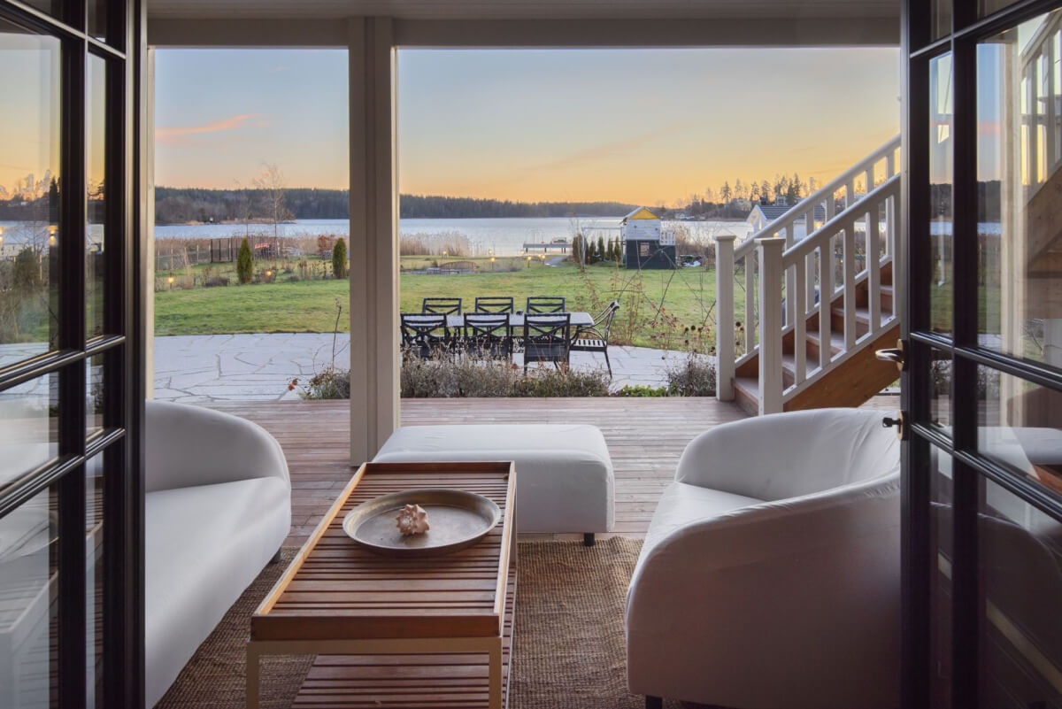 English Manor Style Interiors in a New Swedish Home with Lake Views 21 terrace sea view