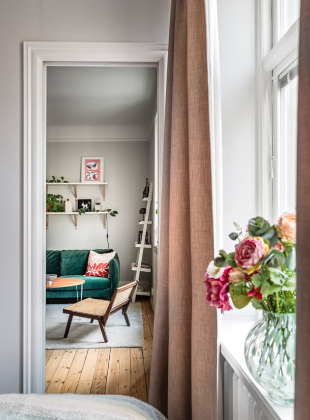 A Small Light-Filled Apartment with a Pink Bedroom 16 tiny bedroom view into living room
