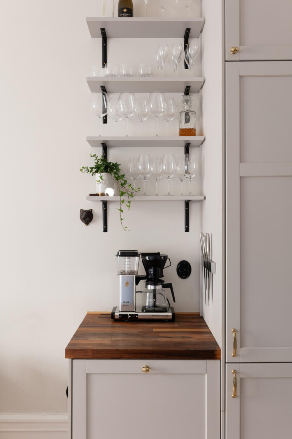 A Small Apartment Decorated in a Light Gray & White Color Palette 12 tiny gray kitchen with shelves