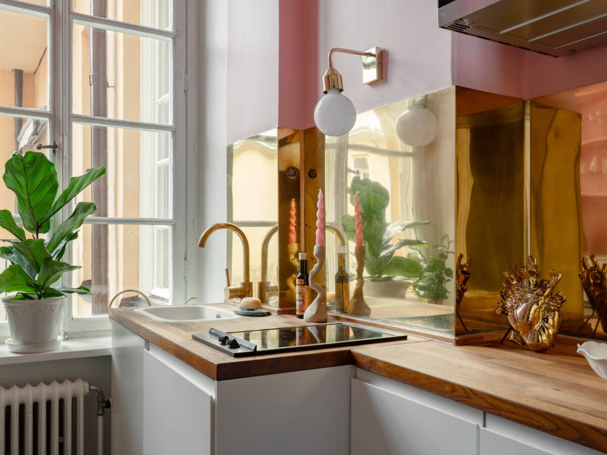 A Small Pink and Blue Apartment with High Ceilings in Stockholm 19 tiny kitchen detail