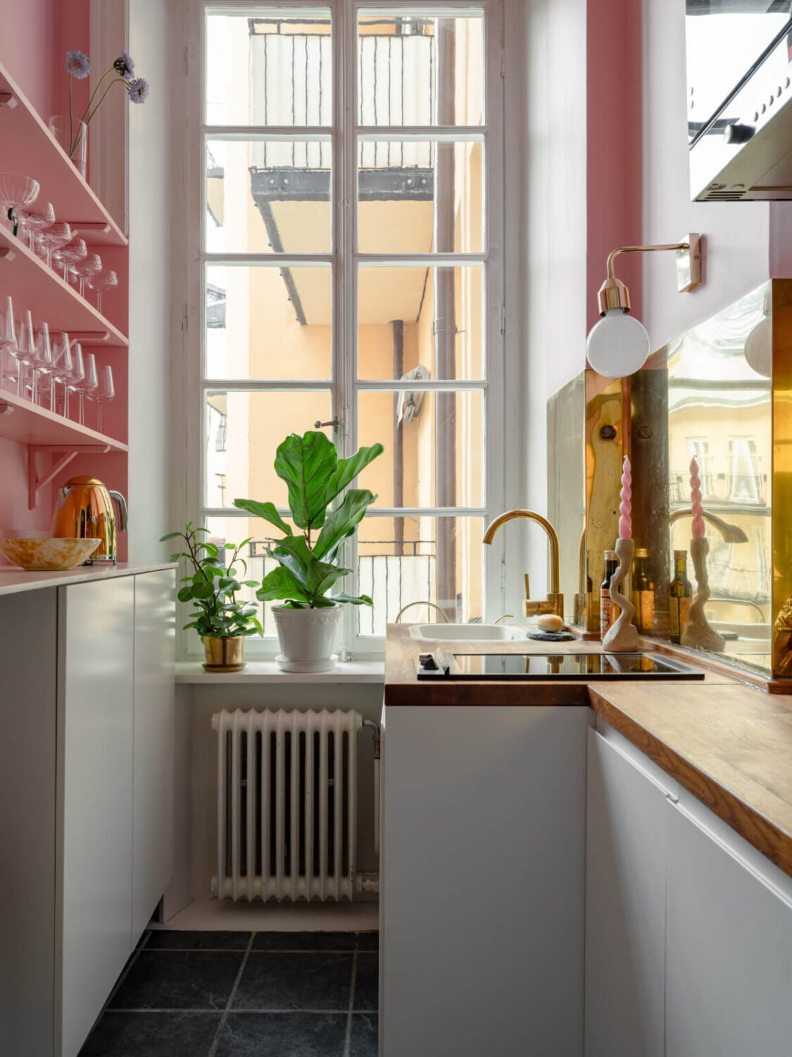 Small Space, Big Style: How to Design a Teeny-Tiny Kitchen That Works 19 tiny kitchen pink walls shelves gold backsplash