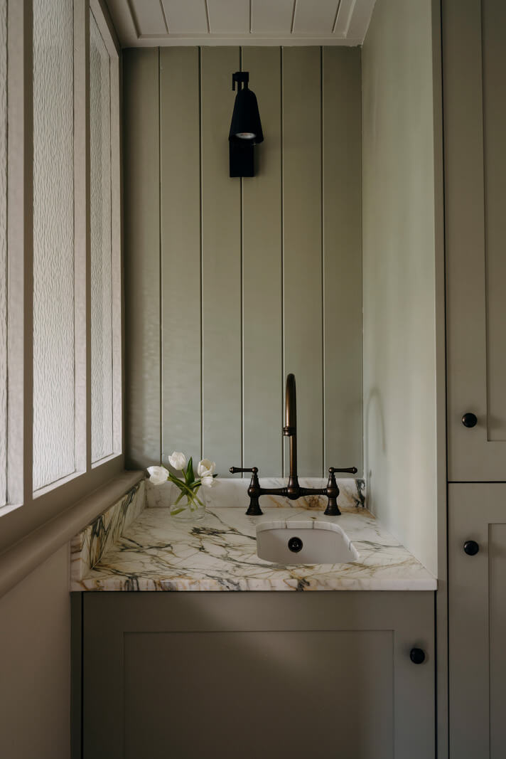 A Cozy and Contemporary Take on a Traditional Log House 15 tiny sink marble top