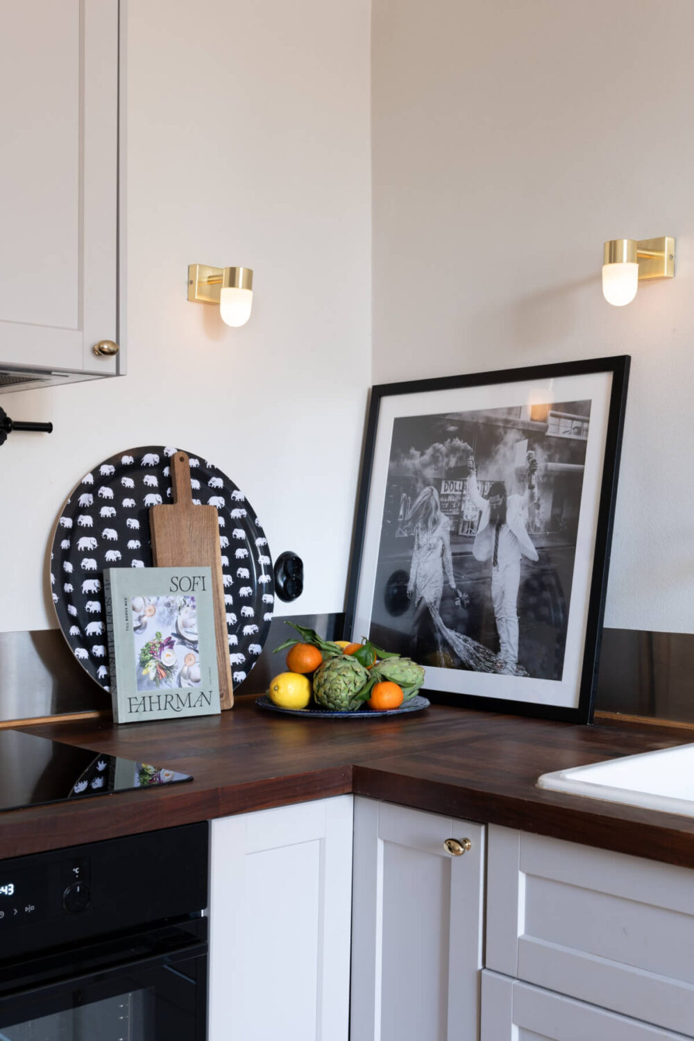 A Small Apartment Decorated in a Light Gray & White Color Palette 11 tiny wall sconces kitchen