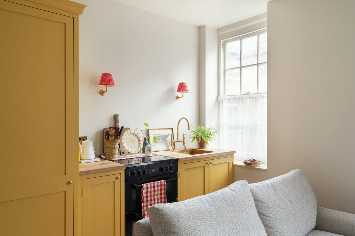 Small Space, Big Style: How to Design a Teeny-Tiny Kitchen That Works 18 tiny yellow kitchen wooden countertop brass fittings