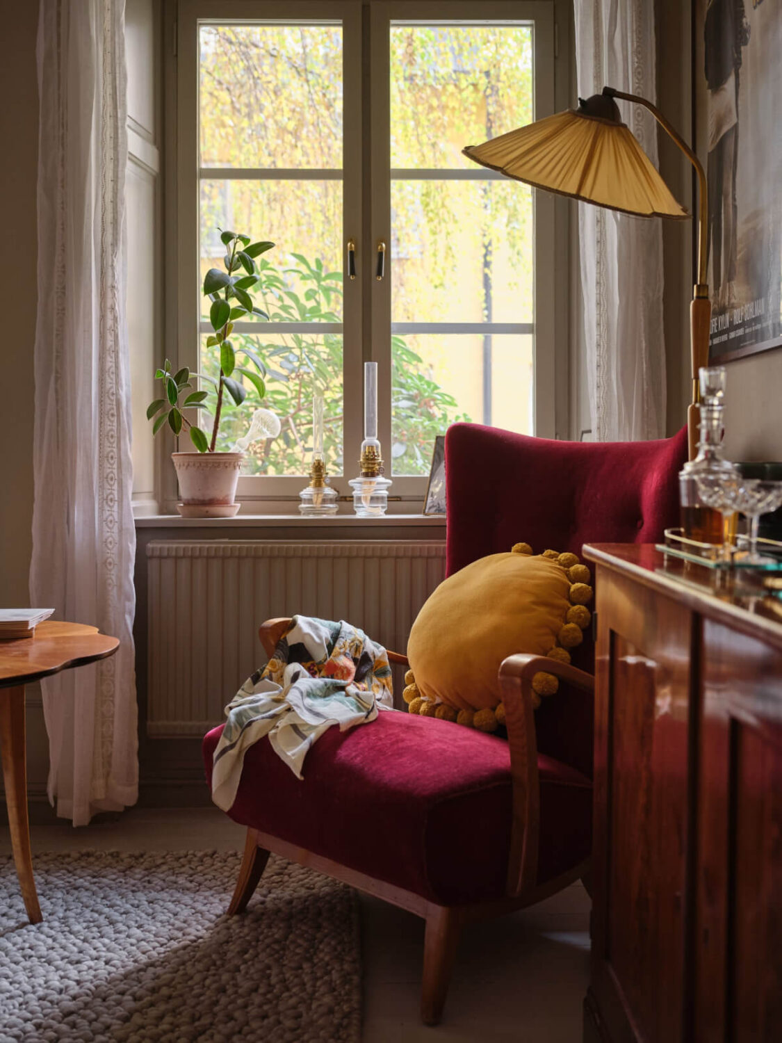 A Charming Vintage Apartment with Historic Wallpapers in Stockholm 3 velvet red armchair