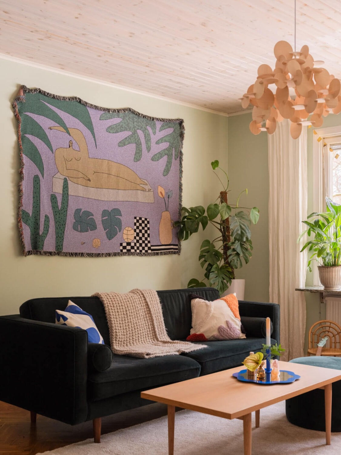 Colorful Decor in a Charming Family Duplex Apartment in Stockholm 6 velvet-sofa-light-green-living-room