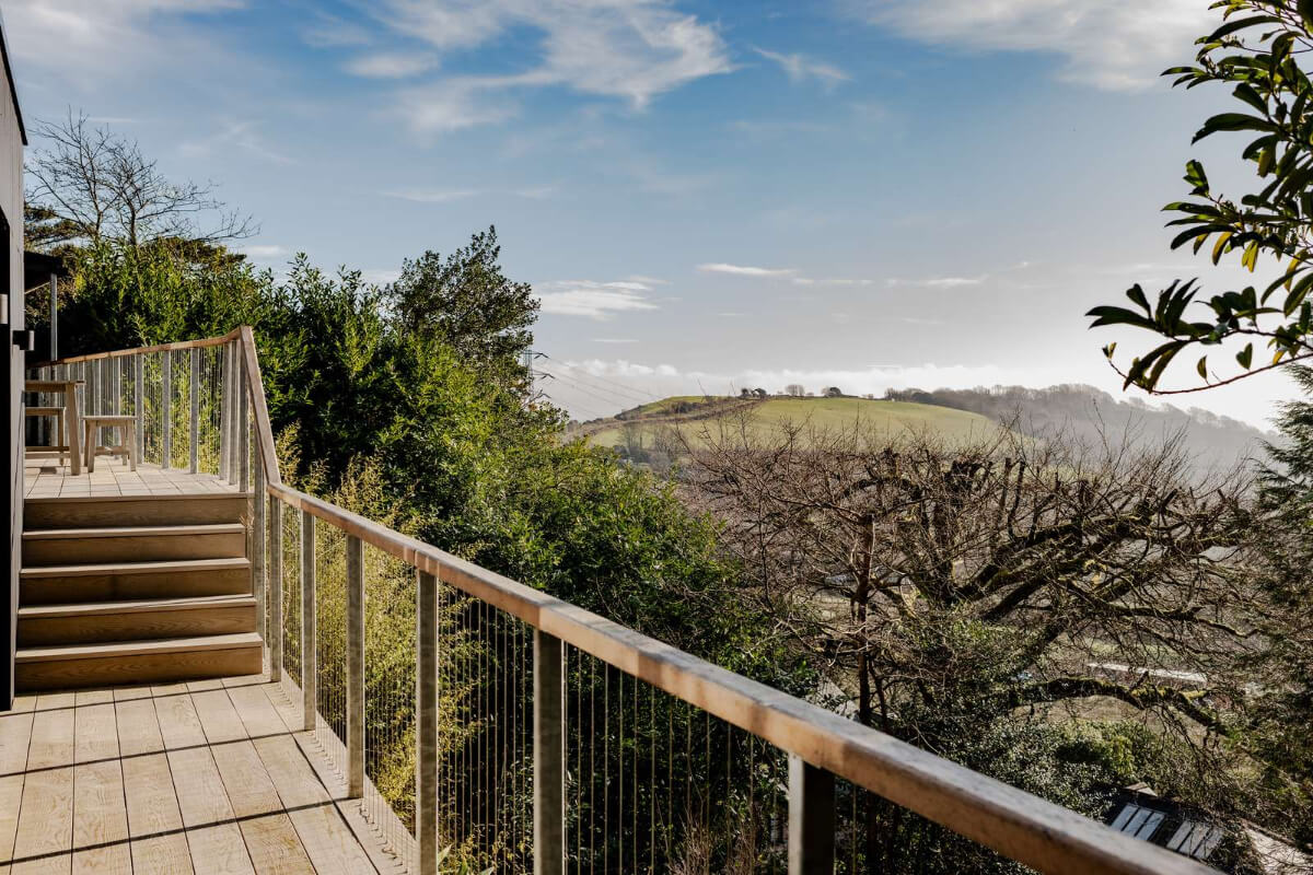 A Japanese-Inspired Timber Home with Views of a Lush Valley 11 view from terrace