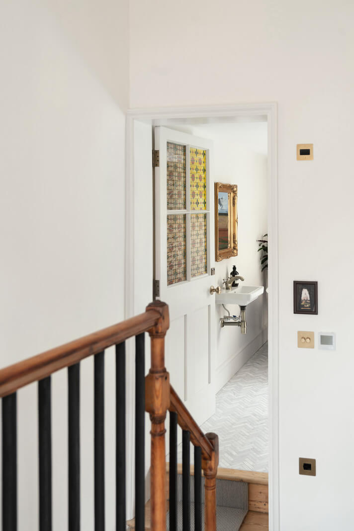 A Renovated Georgian House with an Extended Kitchen 24 view into bathroom