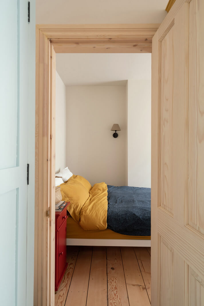 A Tiny Apartment with a Yellow Kitchen in London 10 view into bedroom