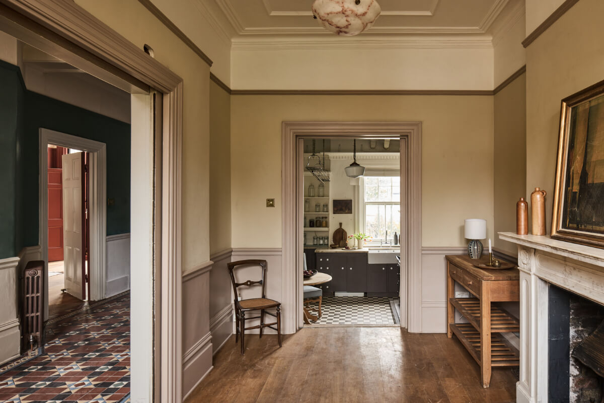 Grand Proportions and Period Details in a Victorian Villa 8 view into kitchen fireplace wooden floor