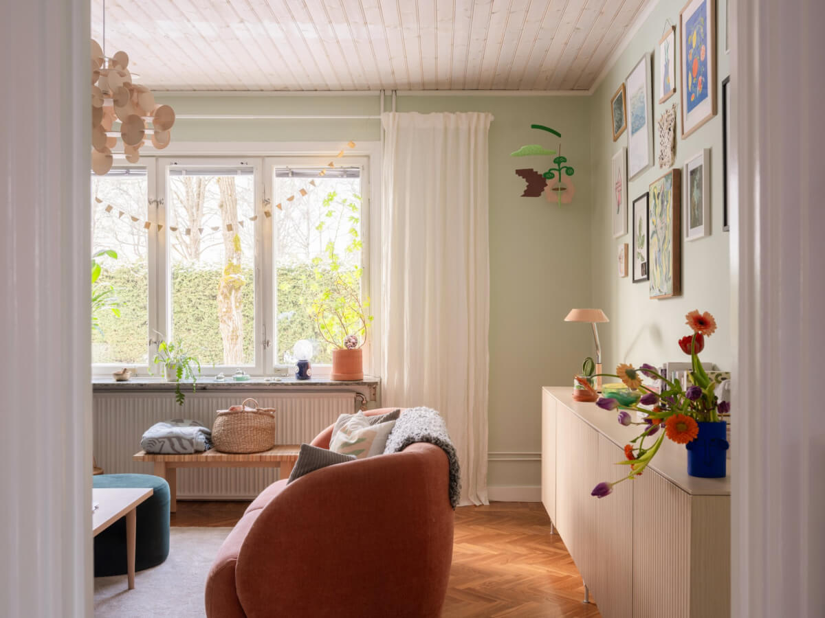 Colorful Decor in a Charming Family Duplex Apartment in Stockholm 4 view into light green living room