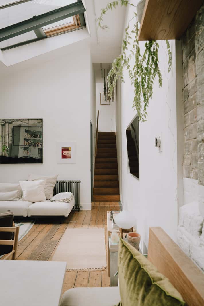 A London Basement Apartment in a Former Wood Workshop 10 view through living room staircase