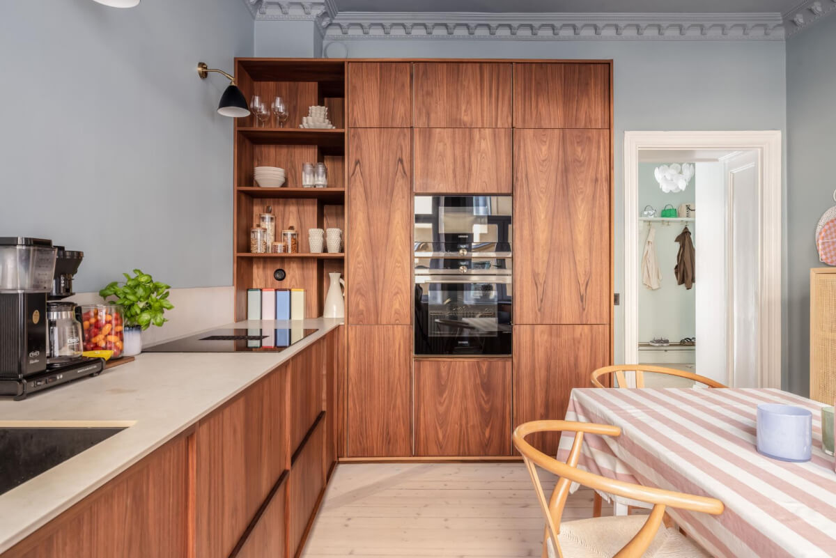 Pastel Colors and Contemporary Design in a Late 19th Century Apartment 11 walnut kitchen open and closed cabinets