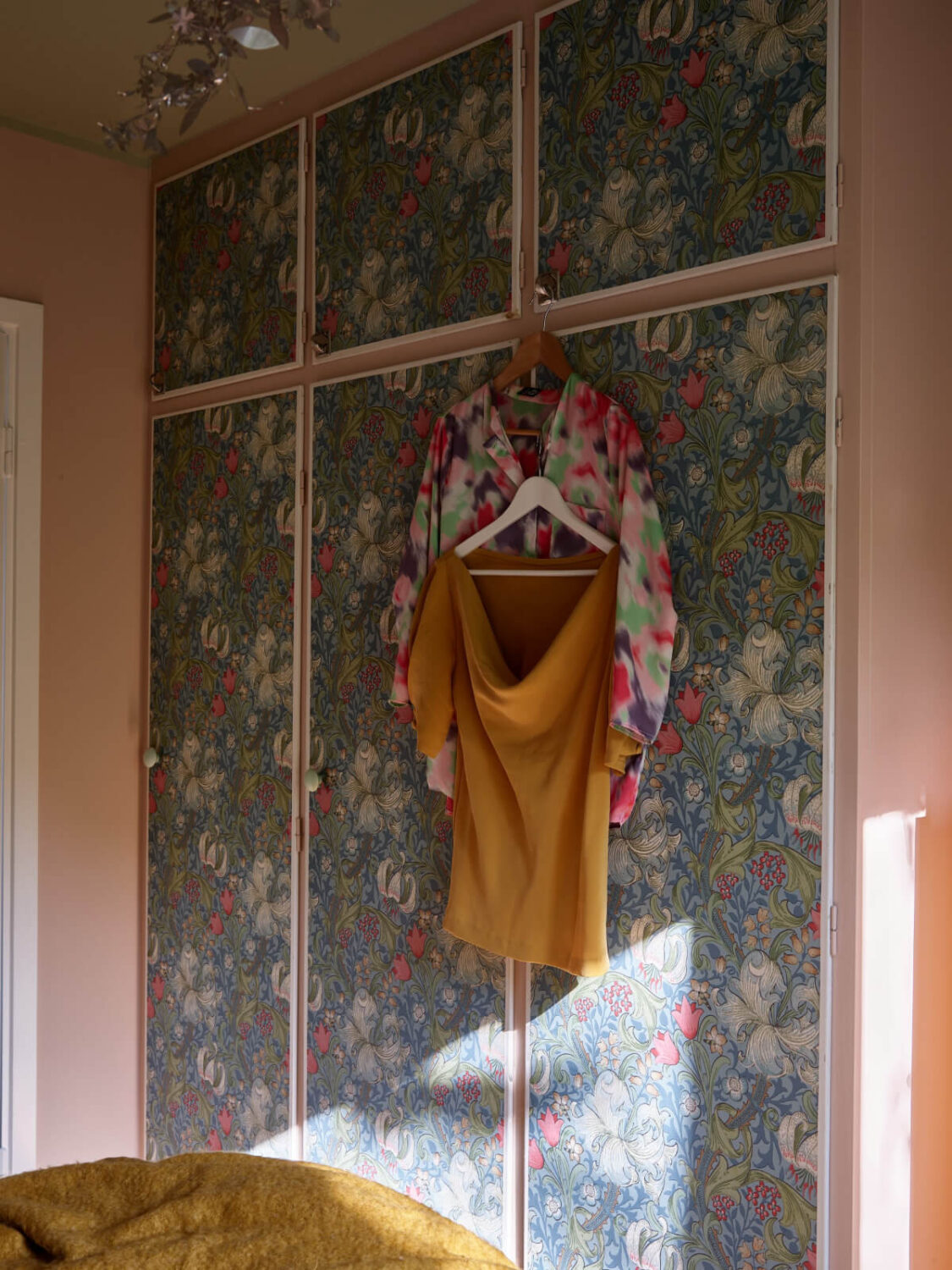 A Lovely Color Palette in a Midcentury Apartment in Sweden 21 wardrobe doors with wallpaper