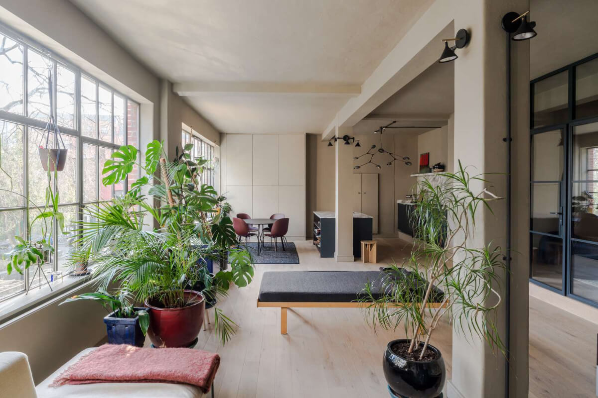 Soft-Colored Contemporary Interiors in a Warehouse Apartment 5 warehouse apartment living area plants