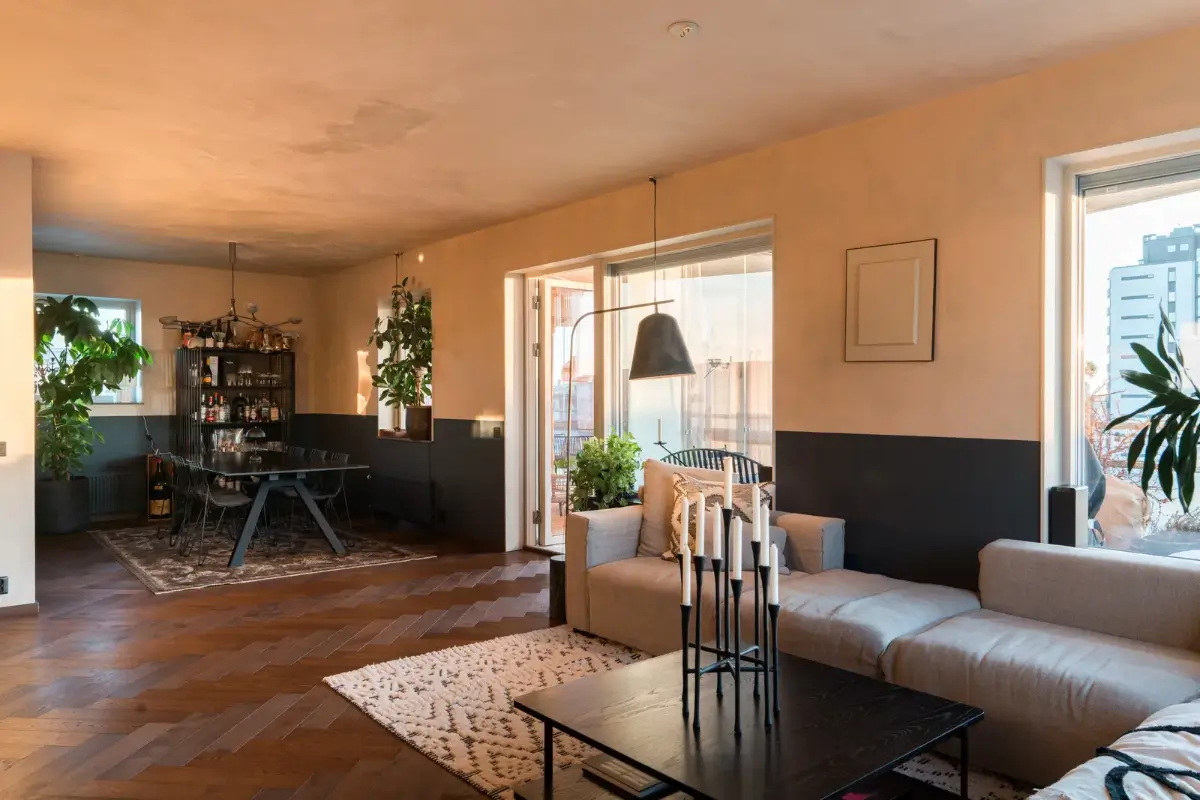A Top Floor Swedish Apartment with a Huge Balcony 9 warm natural light living room