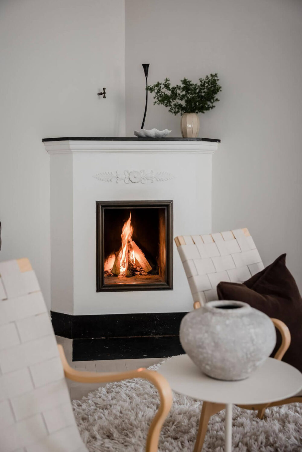 A Light Corner Apartment with an Open Flowing Floor Plan 16 white fireplace