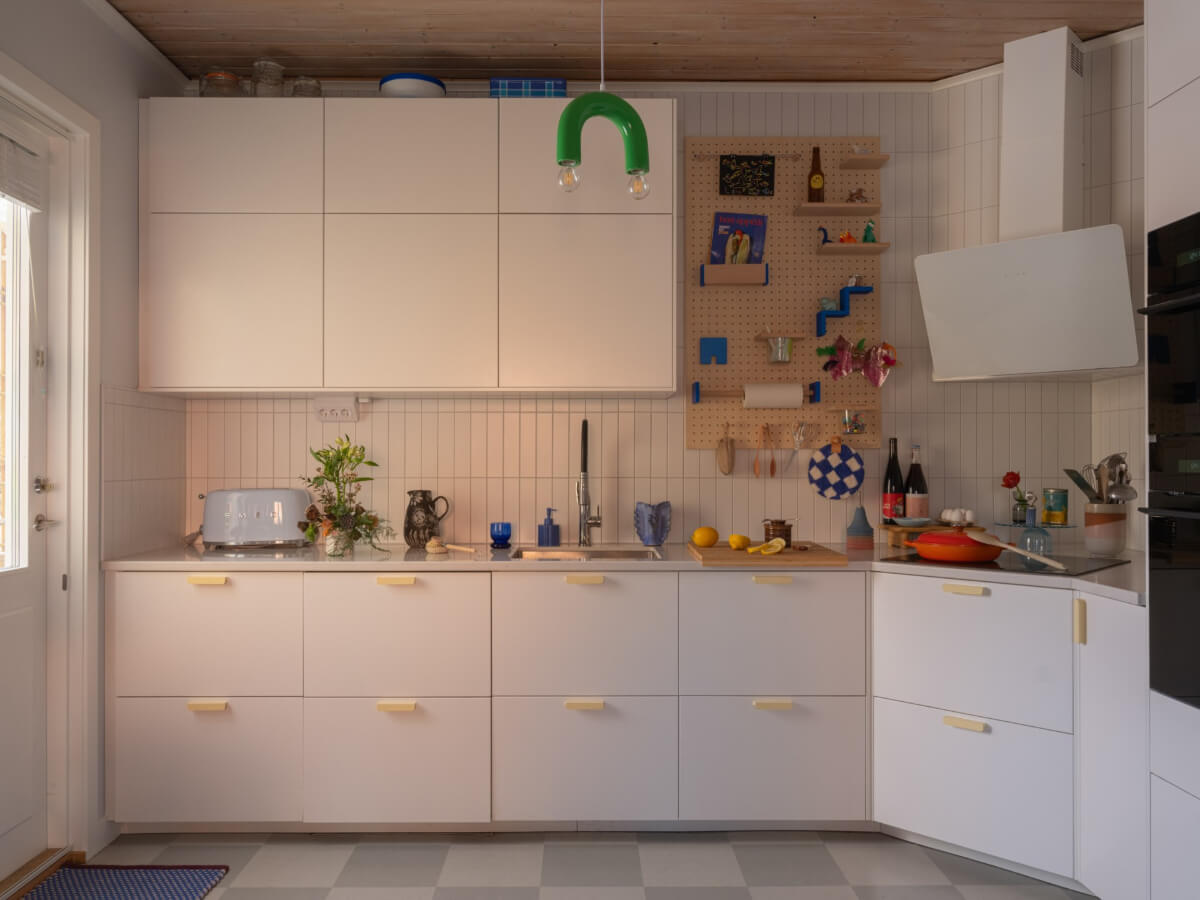 Colorful Decor in a Charming Family Duplex Apartment in Stockholm 13 white kitchen cabinets with pale yellow handles