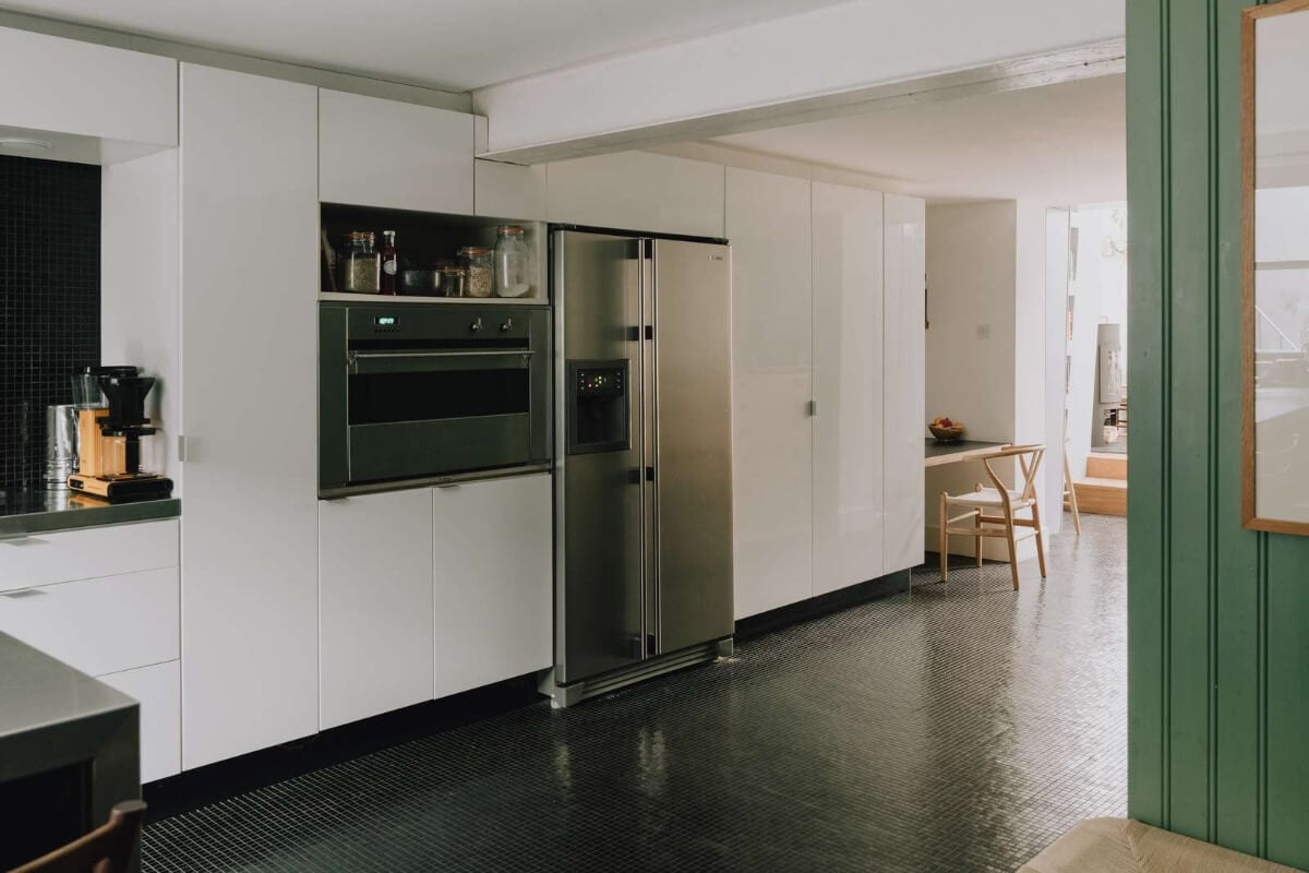 A London Basement Apartment in a Former Wood Workshop 14 white kitchen high cabinets