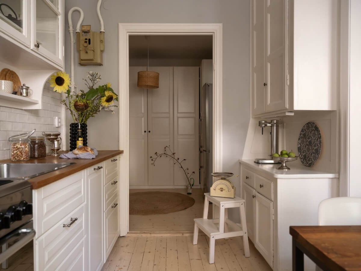 A Charming One-Bedroom Apartment in a 1920s Building 19 white kitchen wooden countertop