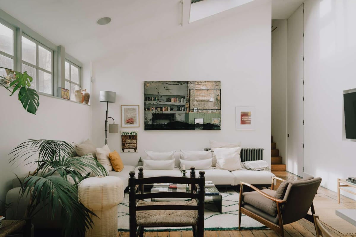 A London Basement Apartment in a Former Wood Workshop 4 white living room wooden floor pitched roof
