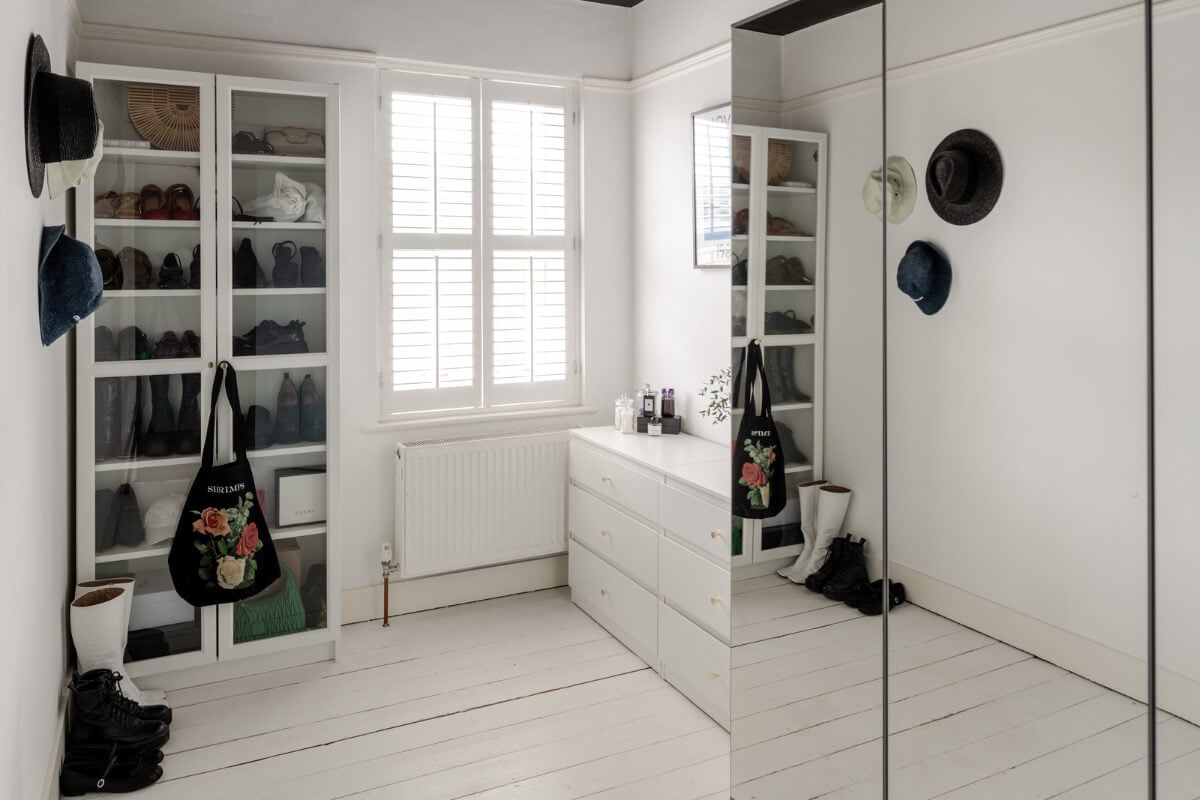 A Contrasting Color Palette in a Renovated Terrace House 15 white-walk-in-closet