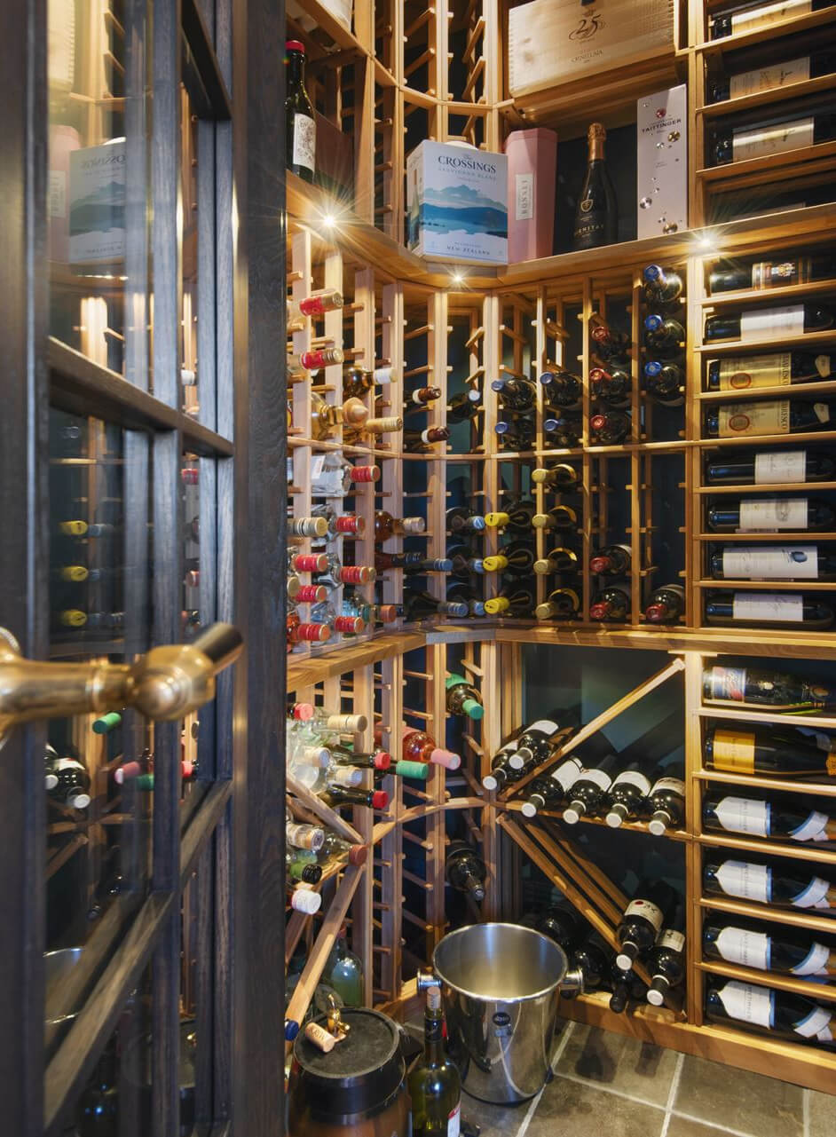 English Manor Style Interiors in a New Swedish Home with Lake Views 16 wine cellar