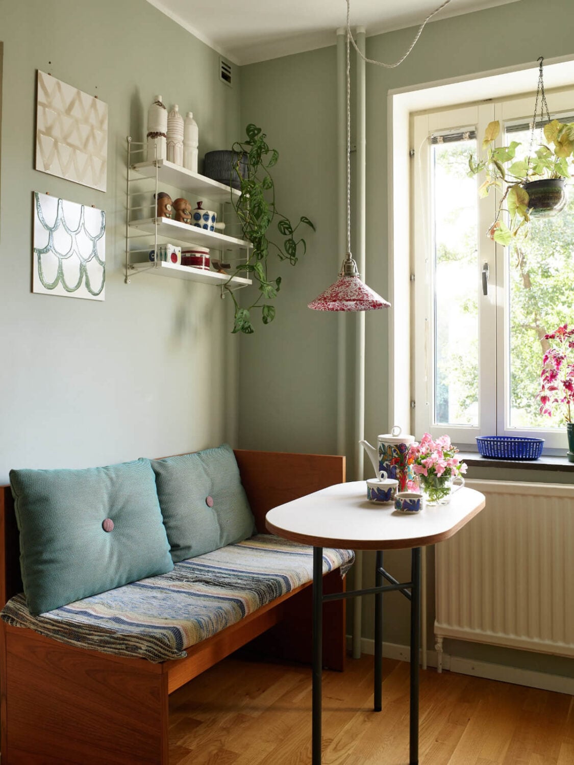 A Lovely Color Palette in a Midcentury Apartment in Sweden 17 wooden bench breakfast table