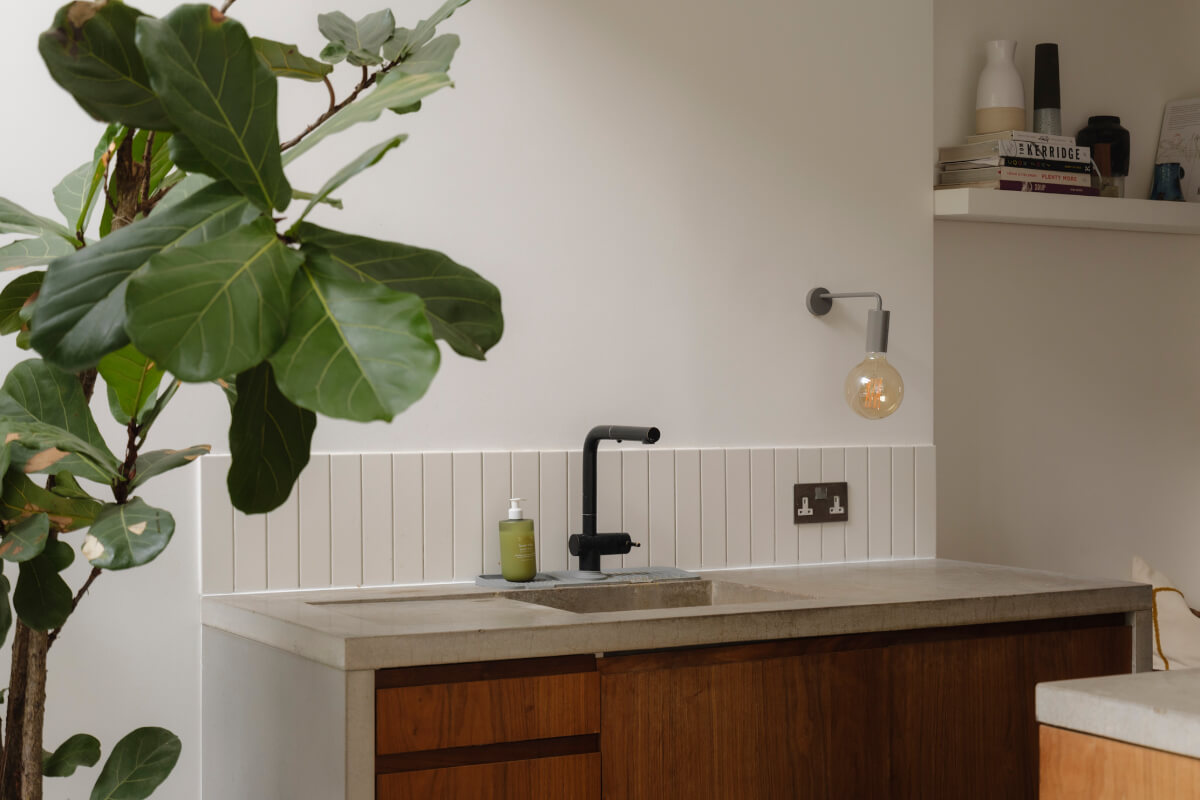 Five-Meter Glazed Garden Doors in an Expanded London Home 8 wooden cupboards concerete worktop