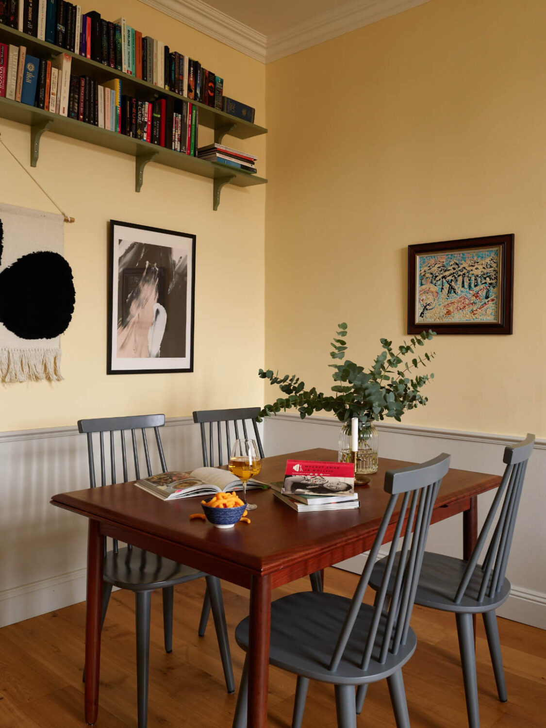 Lovely Color Combinations in a Charming One-Bedroom Apartment 7 yellow living room table