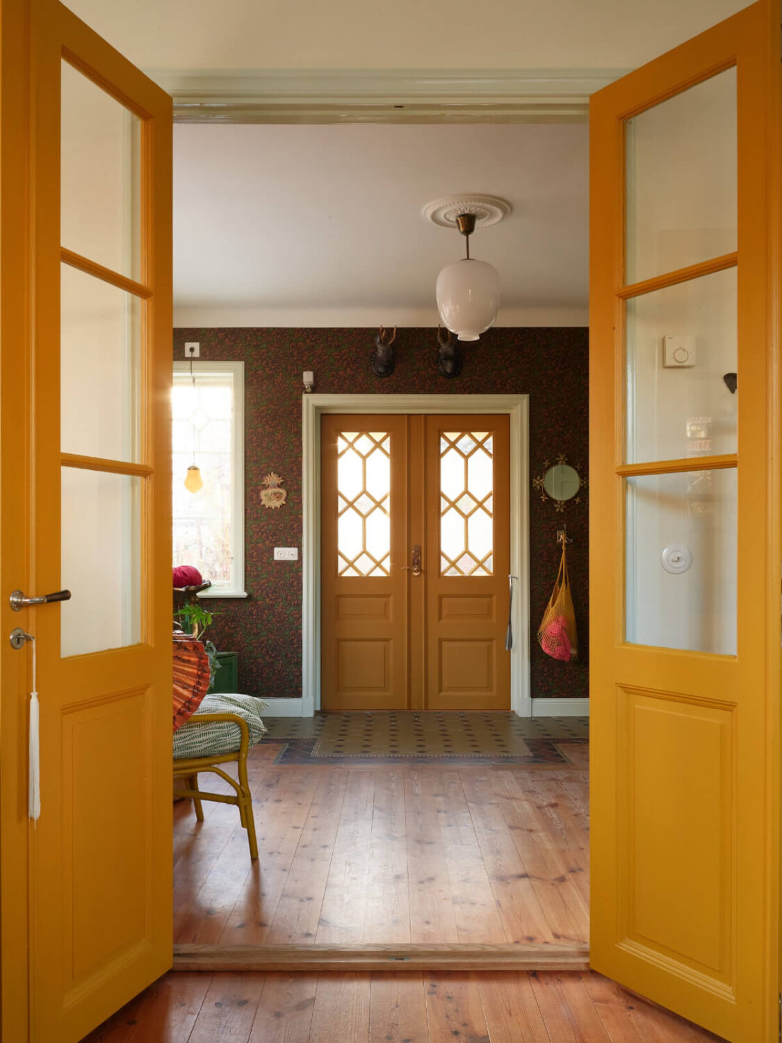 Colorful Interiors in a Wonderful Early 20th Century Swedish Villa 21 yellow wooden doors