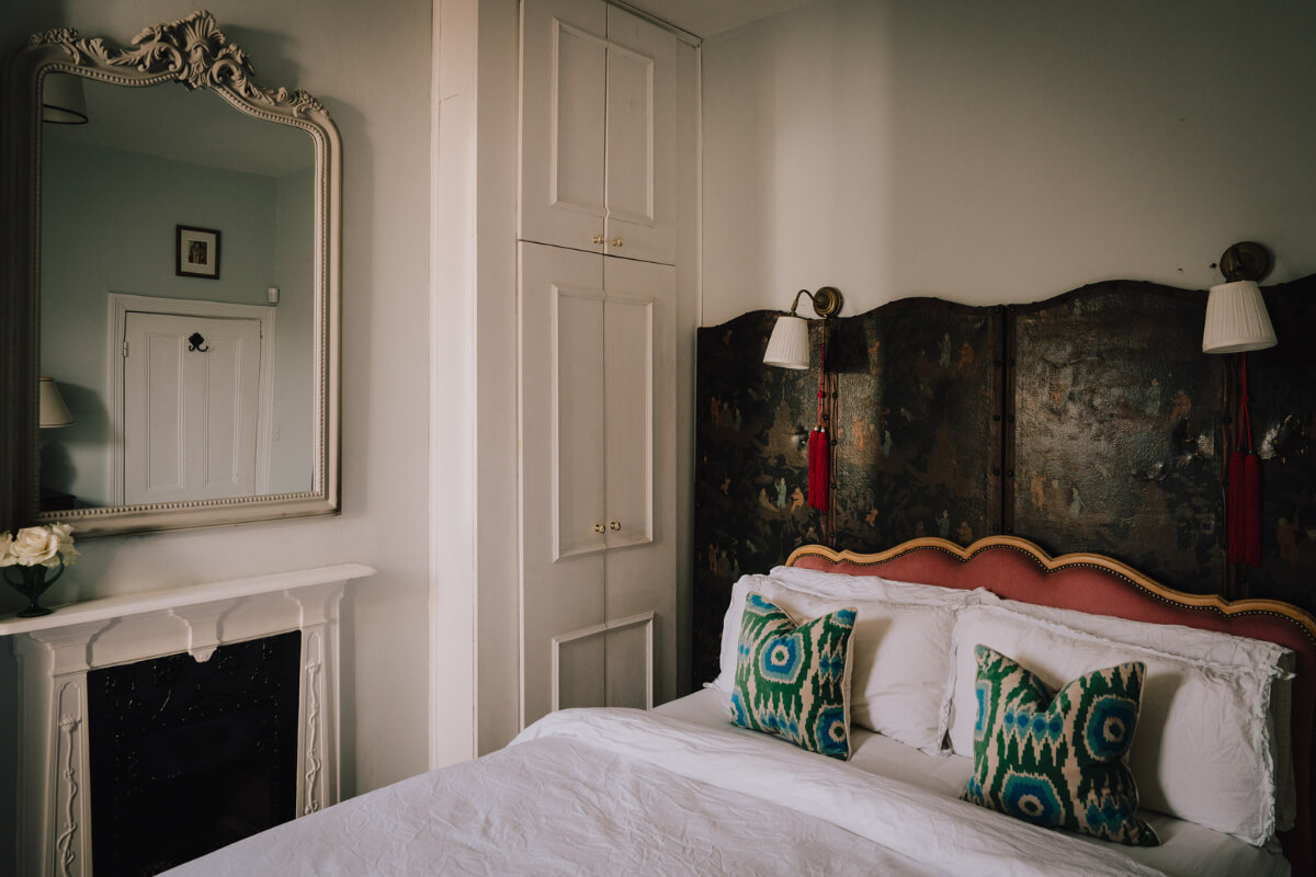 A Carefully Restored Edwardian Apartment with a Garden 11 antique headboard bedroom